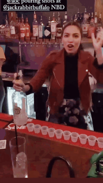 A Woman In A Red Jacket Pouring Shots At Jackrabbit Buffalo GIF