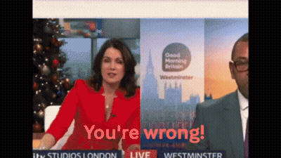 A Woman In A Red Jacket Says " You 'Re Wrong " While A Man In A Suit Looks On GIF