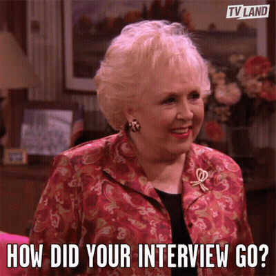 A Woman In A Red Jacket With The Words How Did Your Interview Go GIF