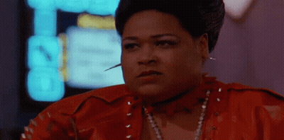 A Woman In A Red Leather Jacket Has A Needle In Her Neck GIF