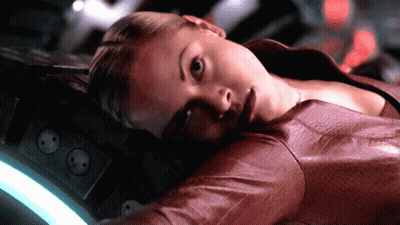 A Woman In A Red Leather Jacket Laying Down GIF