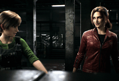 A Woman In A Red Leather Jacket Talks To Another Woman In A Green Shirt GIF