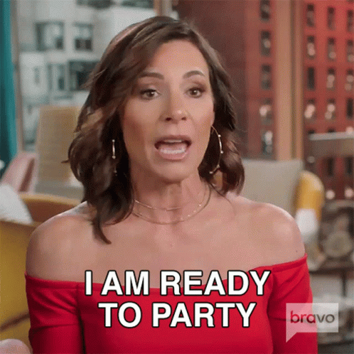 A Woman In A Red Off The Shoulder Top Is Ready To Party GIF