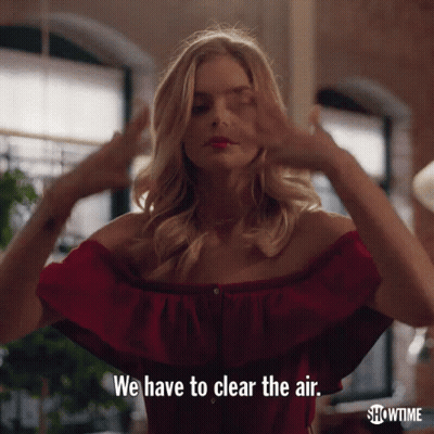 A Woman In A Red Off The Shoulder Top Is Saying We Have To Clear The Air GIF