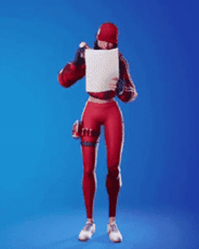 A Woman In A Red Outfit Is Holding A Card With A Heart On It In Front Of Her Face . GIF