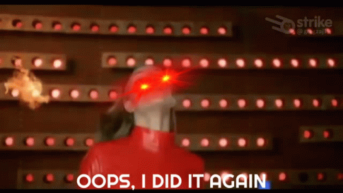 A Woman In A Red Outfit Is Standing In Front Of A Wall With Red Lights And Says Oops I Did It Again . GIF