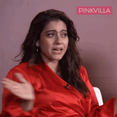 A Woman In A Red Robe With Pinkvilla Written On The Bottom Right GIF