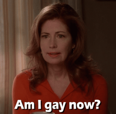 A Woman In A Red Shirt Asks Am I Gay Now GIF