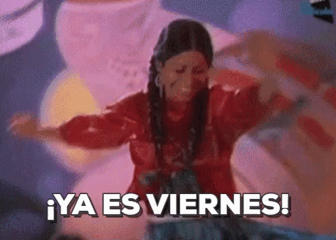A Woman In A Red Shirt Is Dancing With The Words Ya Es Viernes In The Background GIF