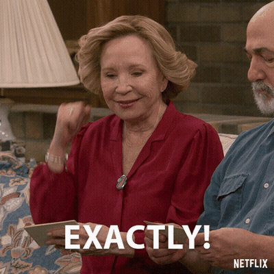 A Woman In A Red Shirt Is Holding A Card That Says Exactly GIF