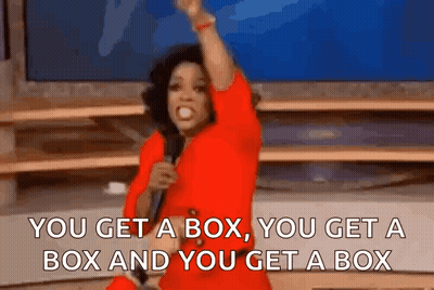A Woman In A Red Shirt Is Holding A Microphone And Saying " You Get A Box You Get A Box GIF