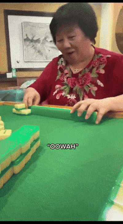 A Woman In A Red Shirt Is Playing Mahjong And Says " Oowah " GIF