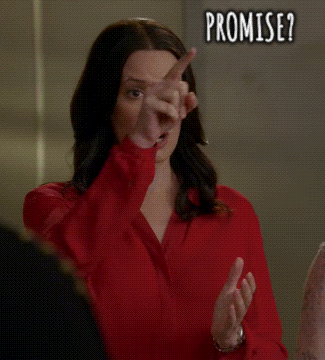 A Woman In A Red Shirt Is Pointing At The Camera With The Words Promise Written On The Bottom GIF