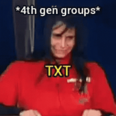 A Woman In A Red Shirt Is Standing In Front Of A Blue Wall With The Words `` 4Th Gen Groups '' Written On It . GIF