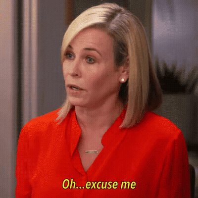 A Woman In A Red Shirt Is Talking And Saying `` Oh Excuse Me '' . GIF