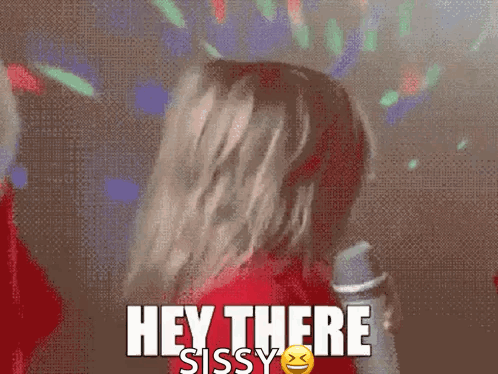 A Woman In A Red Shirt Says Hey There Sissy In Front Of A Disco Ball GIF