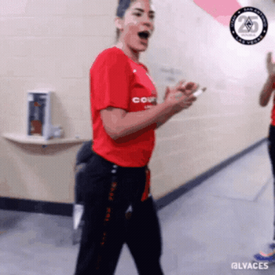 A Woman In A Red Shirt That Says Court Is Dancing GIF