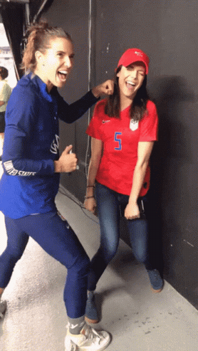 A Woman In A Red Shirt With The Number 7 On It GIF