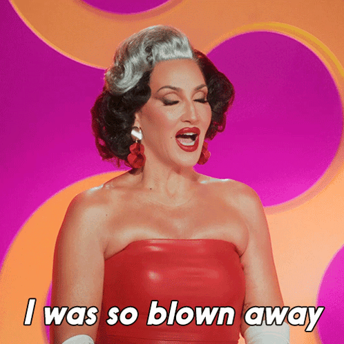A Woman In A Red Strapless Dress Says I Was So Blown Away GIF