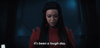 A Woman In A Red Suit Is Saying It 'S Been A Tough Day GIF