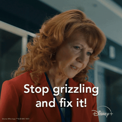 A Woman In A Red Suit Says Stop Grizling And Fix It GIF