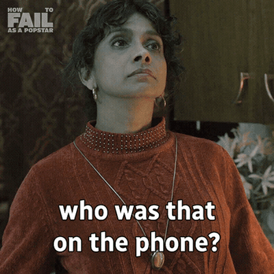 A Woman In A Red Sweater Is Asking Who Was That On The Phone GIF