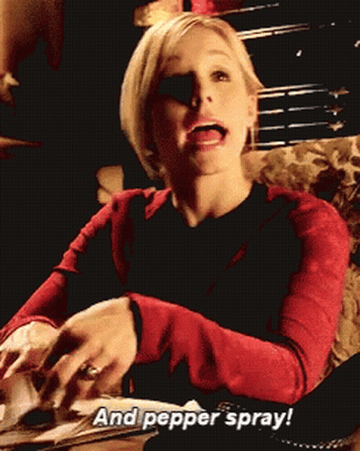 A Woman In A Red Sweater Says " And Pepper Spray " While Sitting On A Couch GIF