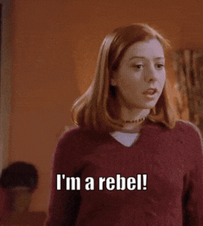 a woman in a red sweater says i 'm a rebel .