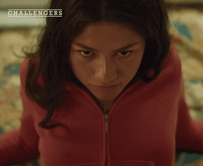 A Woman In A Red Sweatshirt With The Word Challengers On The Bottom Right GIF