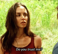 A Woman In A Red Tank Top Is Asking A Man If He Trusts Her . GIF