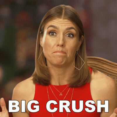 A Woman In A Red Tank Top Is Making A Funny Face And The Words Big Crush Are Behind Her GIF