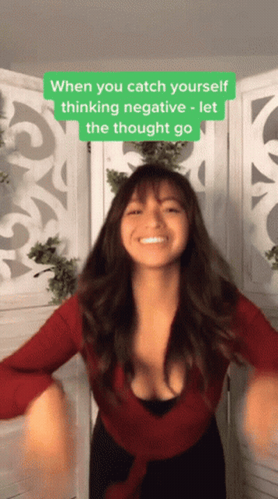 A Woman In A Red Top Is Dancing With A Caption That Says " When You Catch Yourself Thinking Negative Let The Thought Go  GIF
