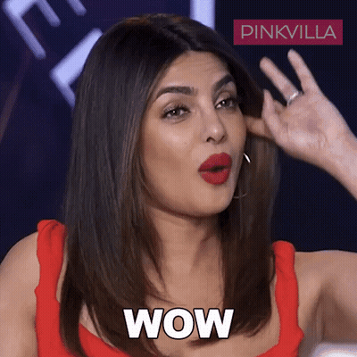 A Woman In A Red Top Is Making A Surprised Face And The Word Wow Is Next To Her GIF