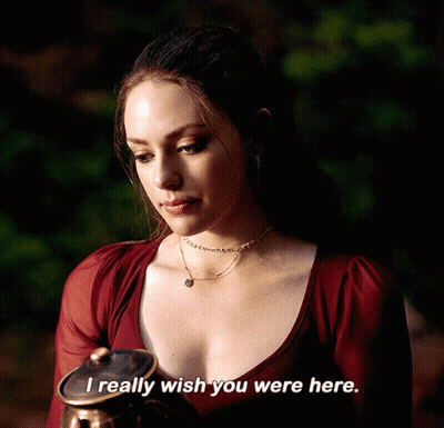 A Woman In A Red Top Says " I Really Wish You Were Here " While Holding A Pot GIF