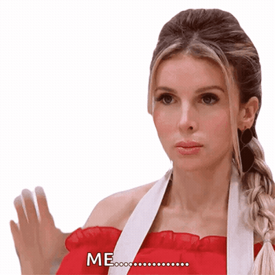 A Woman In A Red Top Says Me With Her Hand Up GIF