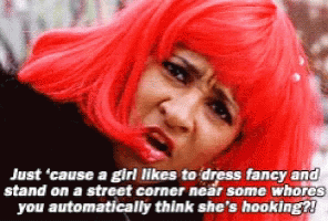 A Woman In A Red Wig Has A Caption That Says " Just Cause A Girl Likes To Dress Fancy " GIF