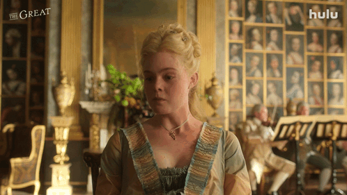 A Woman In A Room With A Hulu Logo On The Bottom GIF