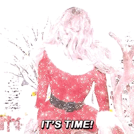 A Woman In A Santa Claus Outfit Is Standing In The Snow And Says `` It 'S Time '' . GIF