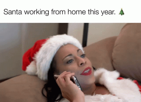 A Woman In A Santa Suit Is Talking On A Cell Phone GIF