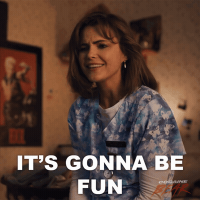 A Woman In A Scrub Top Is Smiling And Says It 'S Gonna Be Fun GIF