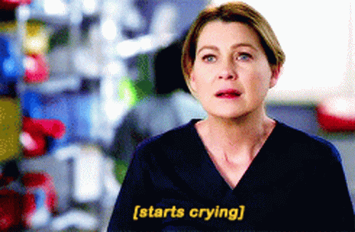 A Woman In A Scrub Top Says " Starts Crying " In Yellow Letters GIF