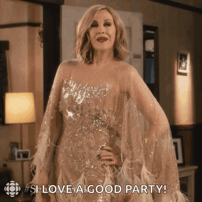 A Woman In A Sequined Gown Says " Love A Good Party " GIF