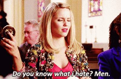 A Woman In A Sequined Jacket Is Holding A Donut And Asking Do You Know What I Hate Men GIF