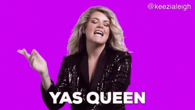 A Woman In A Sequined Jacket Is Making A Funny Face And Saying Yas Queen . GIF