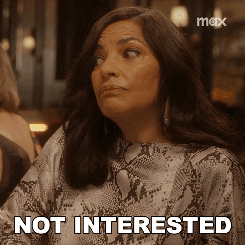A Woman In A Snake Print Shirt Says " Not Interested " GIF