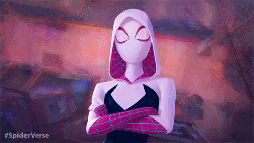 A Woman In A Spiderman Costume With Her Arms Crossed GIF