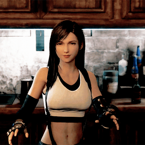 A Woman In A Sports Bra And Black Gloves Stands In A Kitchen GIF