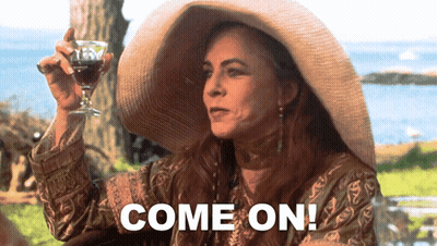 A Woman In A Straw Hat Holds A Glass Of Wine And Says " Come On " GIF