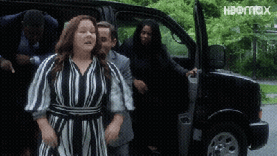 A Woman In A Striped Dress Is Getting Out Of A Van With Hbomax Written On The Bottom GIF