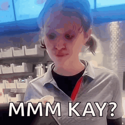 A Woman In A Striped Shirt Is Making A Funny Face And Says Mmmm Kay ? GIF